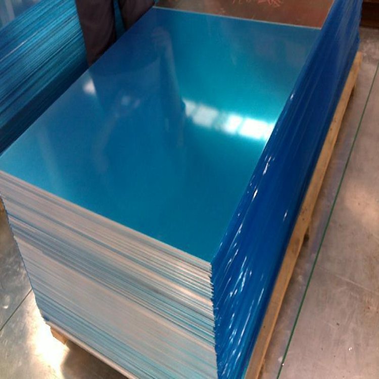 Stacked aluminum sheets covered with blue protective film